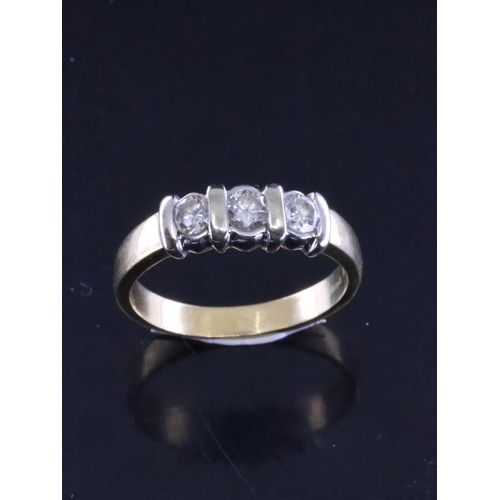 79 - A diamond three stone ring set in 18ct gold finger size N