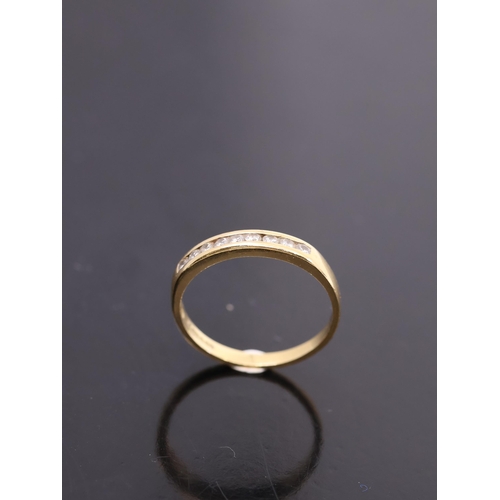 9 - A diamond half eternity ring set in 18ct gold with a copy of a valuation  dated 1998 from Paul Sheer... 