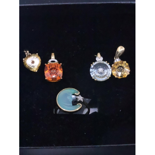 181 - A collection of 9ct gold gem set pendants and a 9ct gold gem set ring