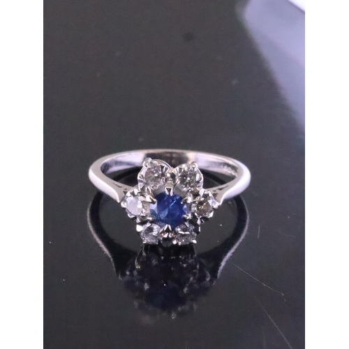 197 - A sapphire and diamond cluster ring finger szie M Half set in 18ct gold