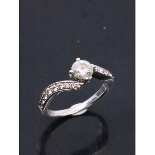 221 - A diamond solitaire ring set with diamond shoulders with a  GSI report which states the diamond is 0... 