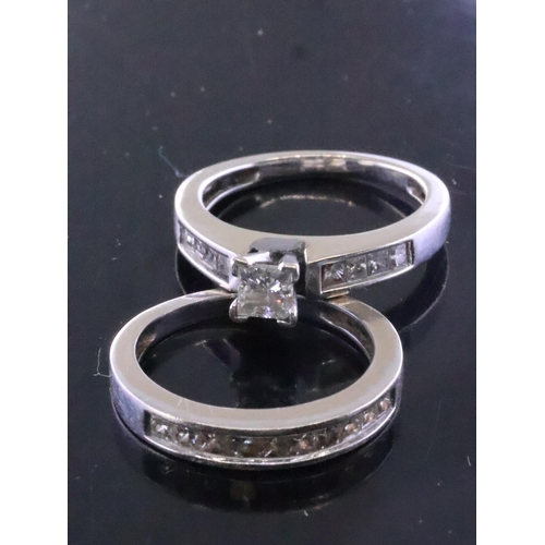 230 - A diamond solitaire ring set with diamond shoulders and a diamond set half eternity total weight app... 