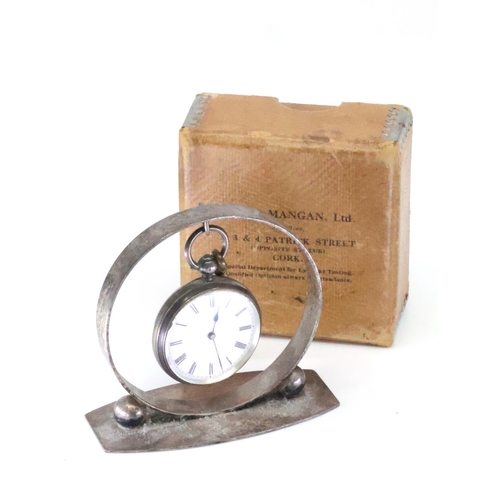 267 - A silver fob watch on a stand, the movement is marked Mangan Cork, with a James Mangan Ltd box (the ... 