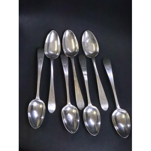 302 - Seven Irish Silver Bright Cut Tablespoons Dublin 1786 (1) & 1789 (3) & 1803 (3) total weight approx.... 