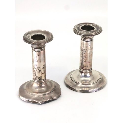 316 - A pair of silver candlesticks approx. 3.5 inches tall