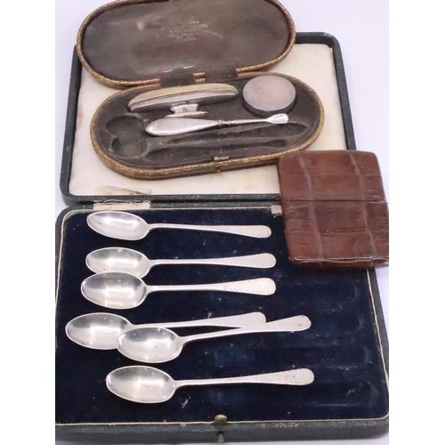 318 - Six silver teaspoons approx. 83.2 grams and a part manicure set (silver) and a case