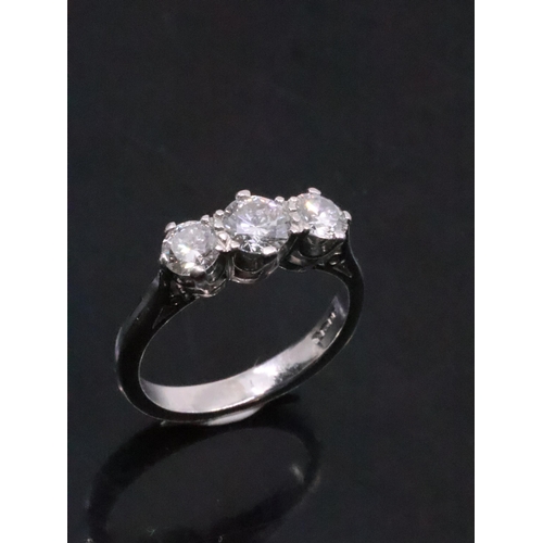 114 - A diamond three stone ring set in platinum finger size K