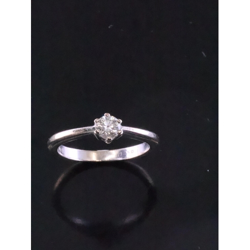 66 - A diamond solitaire ring set in 18ct gold, estimated weight of diamond 0.25cts with a copy of a valu... 
