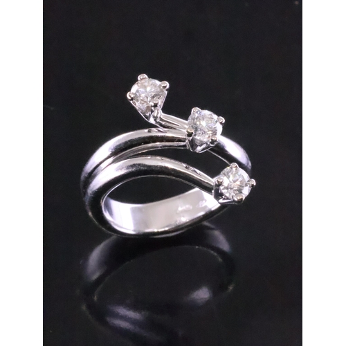 84 - An 18ct gold diamond three stone ring finger size J half to K