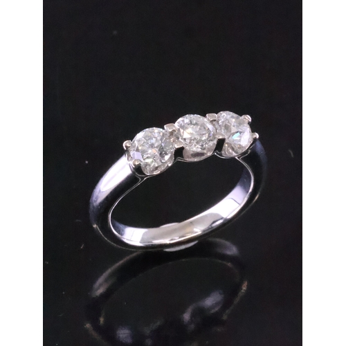 90 - A diamond three stone ring, total estimated weight of diamonds 1.20cts, set in 18ct gold finger size... 