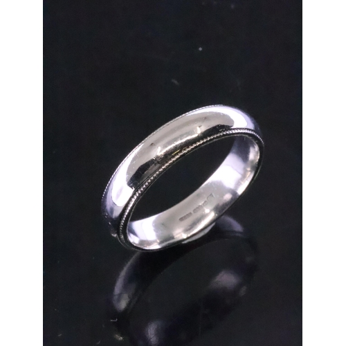 91 - A platinum wedding ring, estimated weight 6.2g finger size R