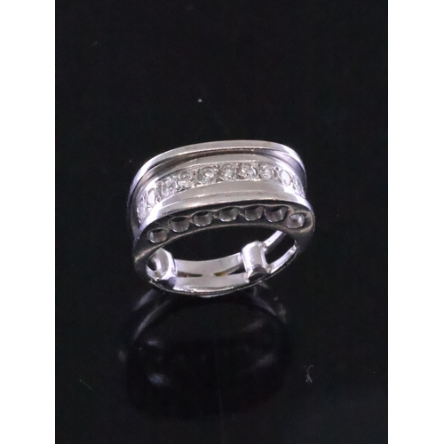 17 - A diamond set dress ring, finger size E (band spacers)