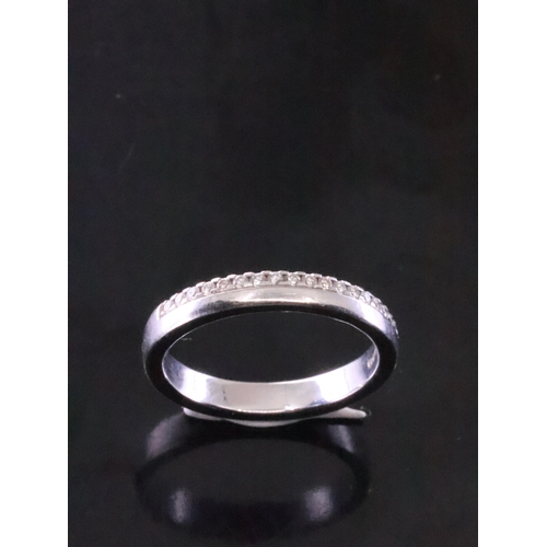 18 - A diamond set wedding band set in 18ct gold finger size K half