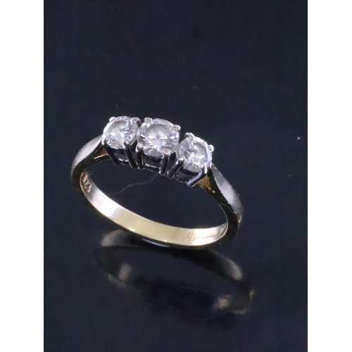 20 - A diamond three stone ring set in 18ct gold finger size O, total estimated weight of diamonds 0.75ct... 