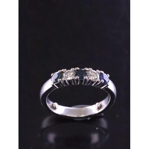 35 - A diamond and sapphire five stone ring finger size G (note spacers in band), total estimated weight ... 