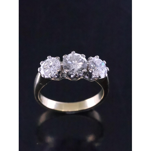 39 - A diamond three stone ring set in 18ct gold total estimated weight of diamonds 3.20cts finger size S... 