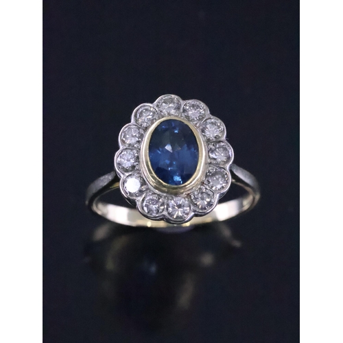 40 - A sapphire and diamond cluster ring set in 18ct gold finger size T Half set in 18ct gold