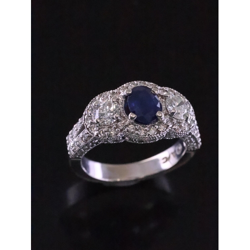42 - A sapphire and diamond three stone cluster ring finger size O Half