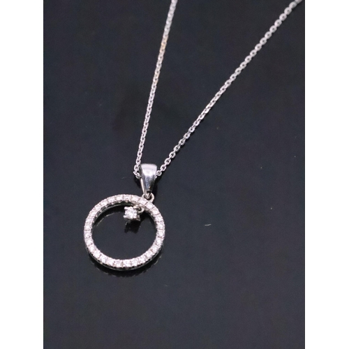 46 - A diamond set pendant in 18ct gold on an 18ct gold chain approx. 2.4 grams