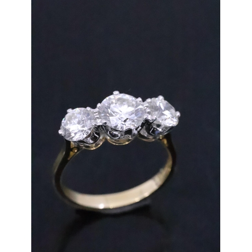 55 - A fine diamond three stone ring set in 18ct gold, total estimated weight of diamond 3.14cts finger s... 