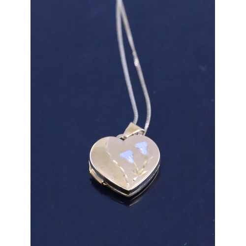 143 - A 9ct gold heart shaped locket on chain approx. 2.7 grams