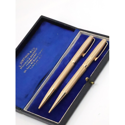 92 - A 9ct gold pen and a 9ct gold pencil total weight approx. 52.8 grams