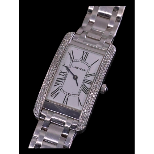 223 - A ladies 18ct white gold diamond set watch, weight 101 grams