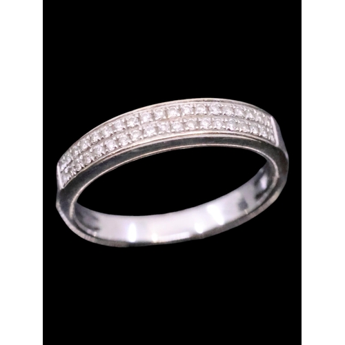 25 - A diamond double row half eternity ring set in 18ct gold finger size M half approx. 2.7 grams