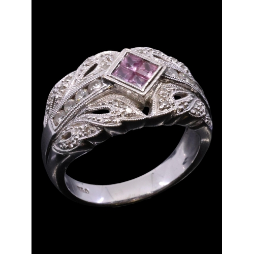 3 - A pink sapphire and diamond cluster ring set in 18ct gold finger size M