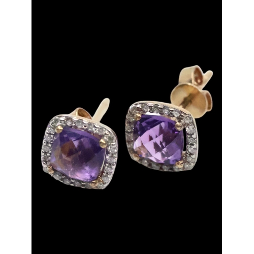 32 - A pair of amethyst and diamond cluster earrings set in 9ct gold