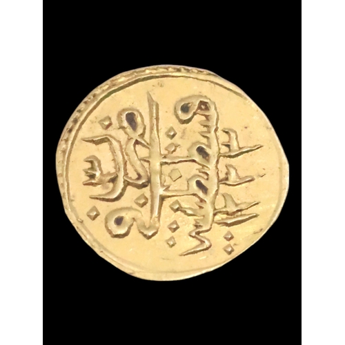 334 - A gold coin approx. 0.6 grams