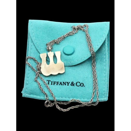 36 - A silver tiffany pendant on chain with pouch