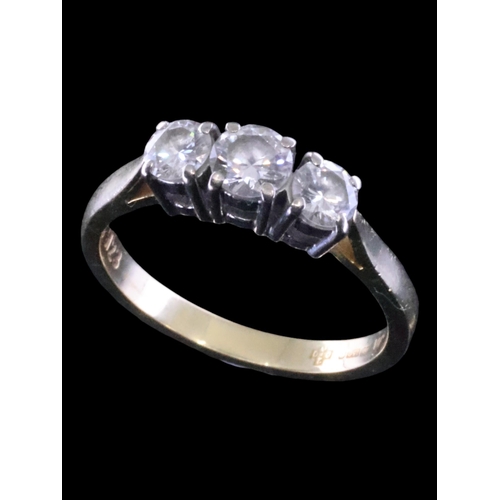 4 - A diamond three stone ring set in 18ct gold finger size O, total estimated weight of diamonds 0.75ct... 