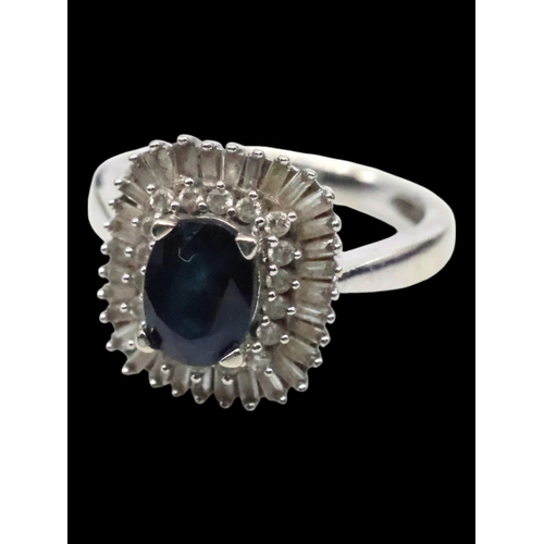 42 - A sapphire and diamond cluster ring finger size K