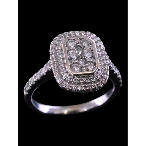 56 - A diamond cluster ring set in 18ct gold, approx. 4.8 grams finger size I