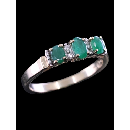 59 - An emerald and diamond cluster ring finger size N