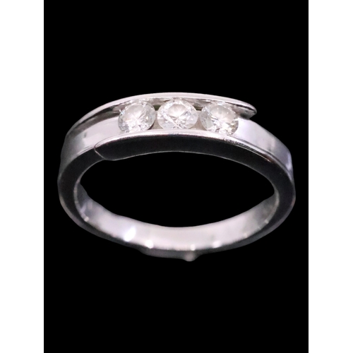 6 - A diamond three stone ring, finger size J and half