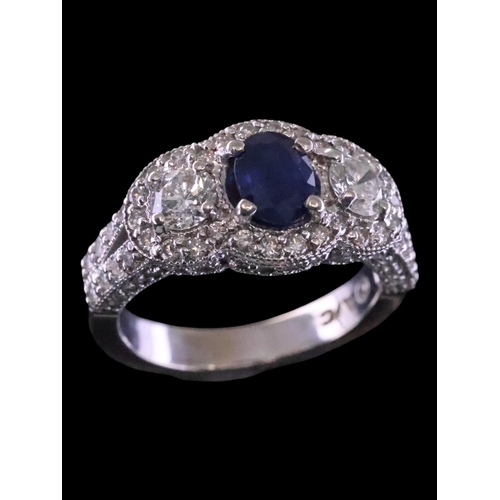 7 - A sapphire and diamond three stone ring finger size O Half with a copy of a valuation which states t... 