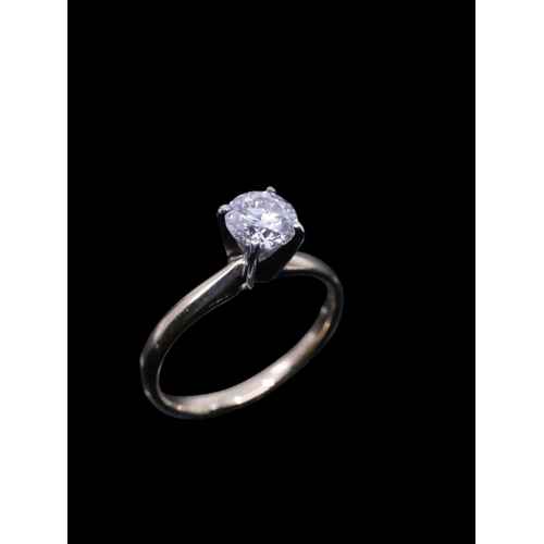 100 - A 14ct gold diamond solitaire ring finger size I