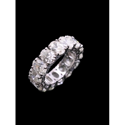 141 - A fine diamond full eternity ring, total estimated weight of diamonds 12cts finger size L Half