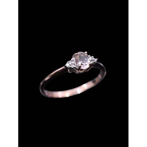 234 - A diamond and gem ring set in 9ct rose gold, finger size M