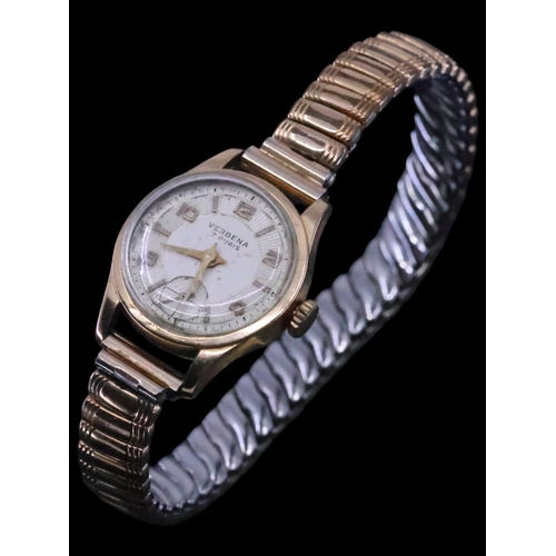 266 - An 18ct gold watch on a metal bracelet