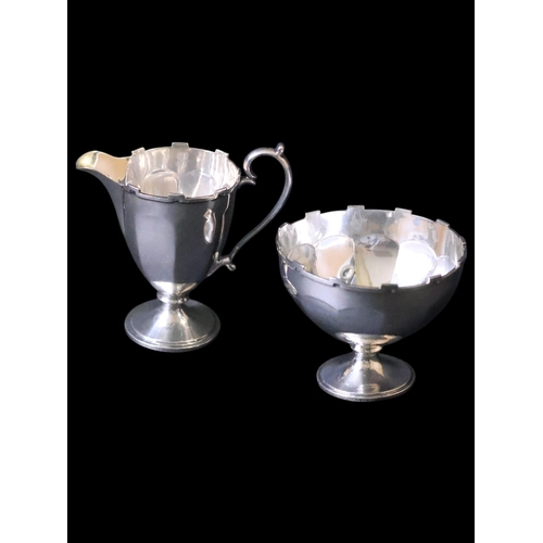 291 - A silver sugar bowl  Birm 1925 and cream jug  Birm 1921 total weight approx. 138 grams