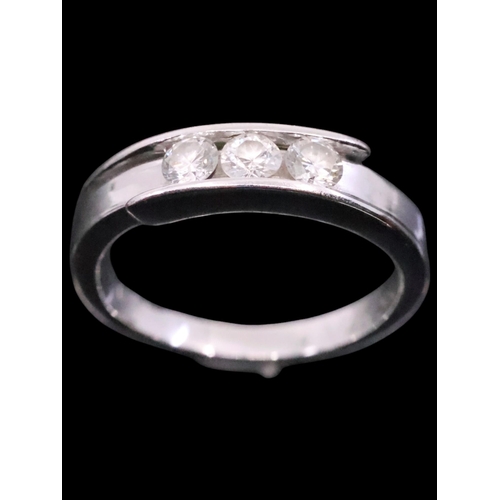 3 - A diamond three stone ring, finger size J and half