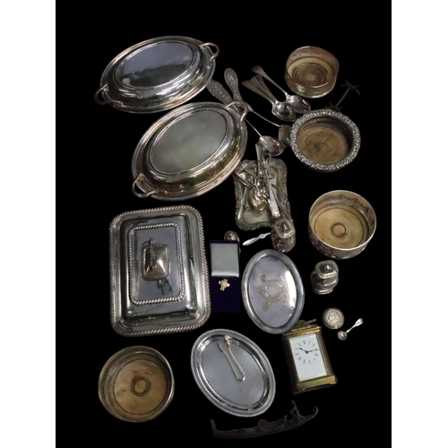 304 - A collection of silverplated ware a carriage clock