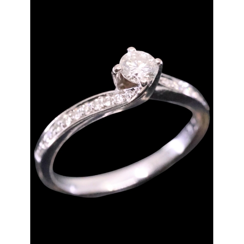 51 - A diamond solitaire ring finger size M set in 18ct gold