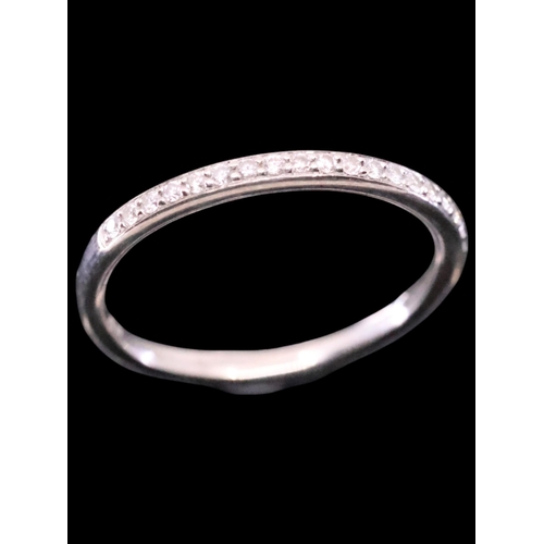 52 - A diamond half eternity ring finger size M set in 18ct gold