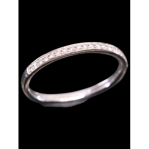 53 - A diamond half eternity ring finger size M set in 18ct gold