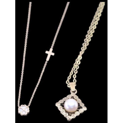 61 - Two gem set gold pendants on chains approx. 4.9 grams (one 14ct)