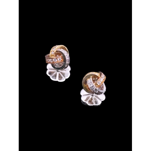 137 - A pair of diamond knot earrings set in 18cts gold